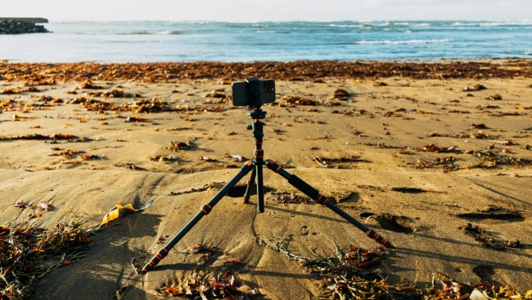 Lightweight travel tripod set up outdoors for stable photography during travel adventures