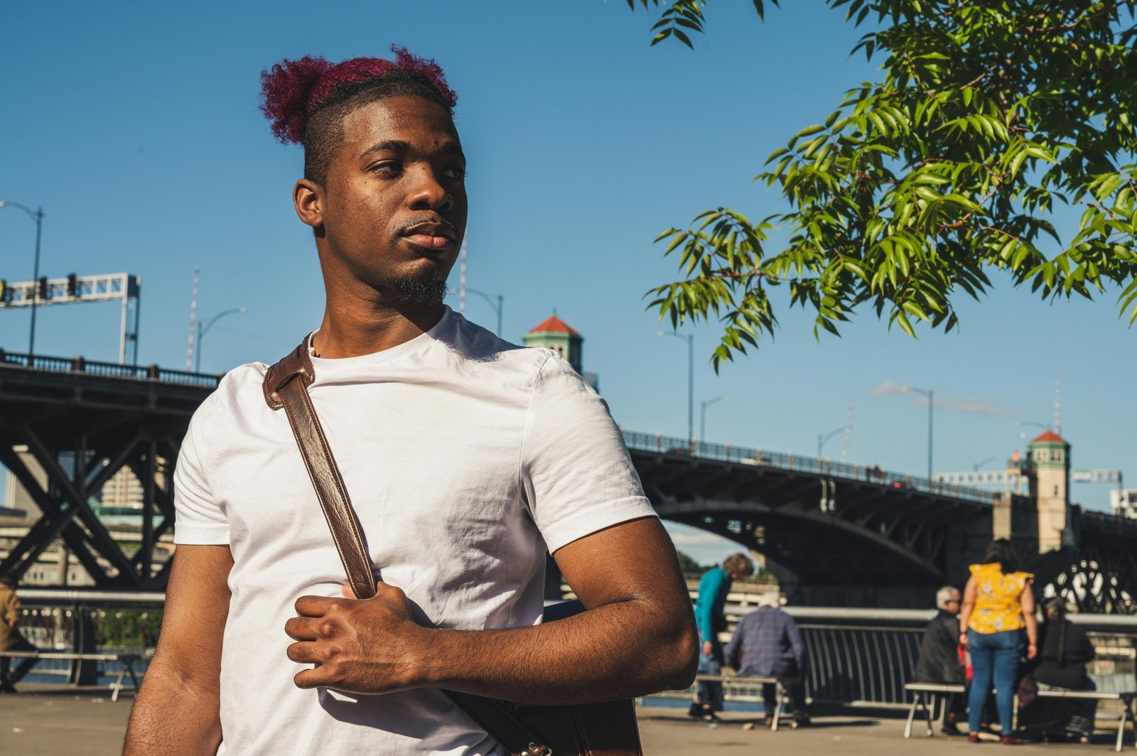 Traveler wearing a lightweight crossbody travel bag walking in the city, showcasing comfort, secure travel gear, and hands-free convenience