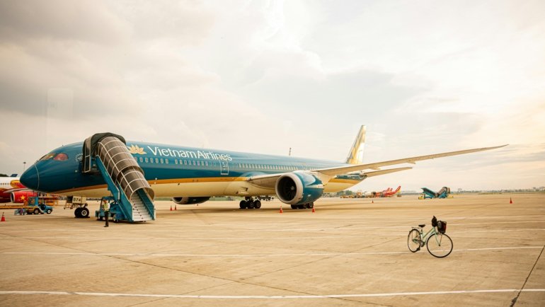 Bicycle packed in a durable hard-shell travel case ready for air travel at the airport