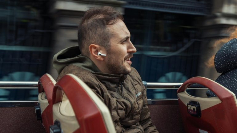 Traveler wearing a lightweight travel hoodie with hidden pockets, staying comfortable and stylish during journey