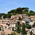 Scenic view of a peaceful southern France coastal village with blooming flowers and sunny weather in spring