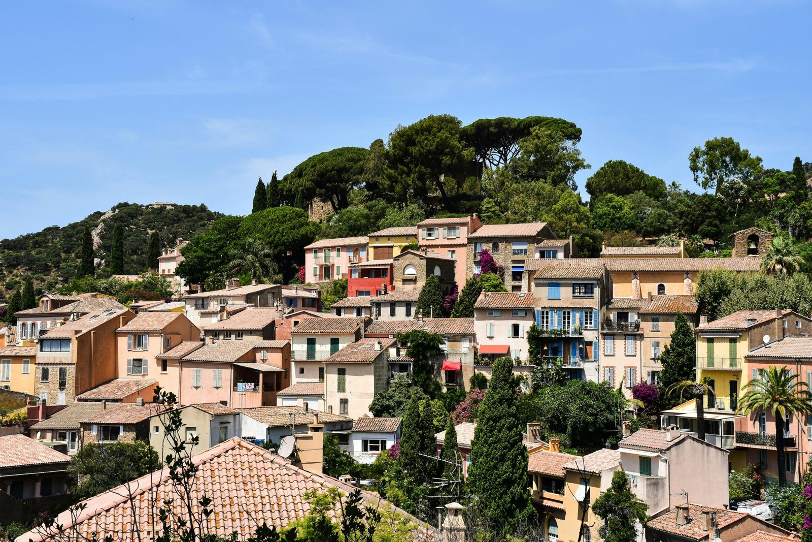 Scenic view of a peaceful southern France coastal village with blooming flowers and sunny weather in spring
