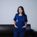 Travel certified nursing assistant in scrubs at healthcare facility ready for new assignments