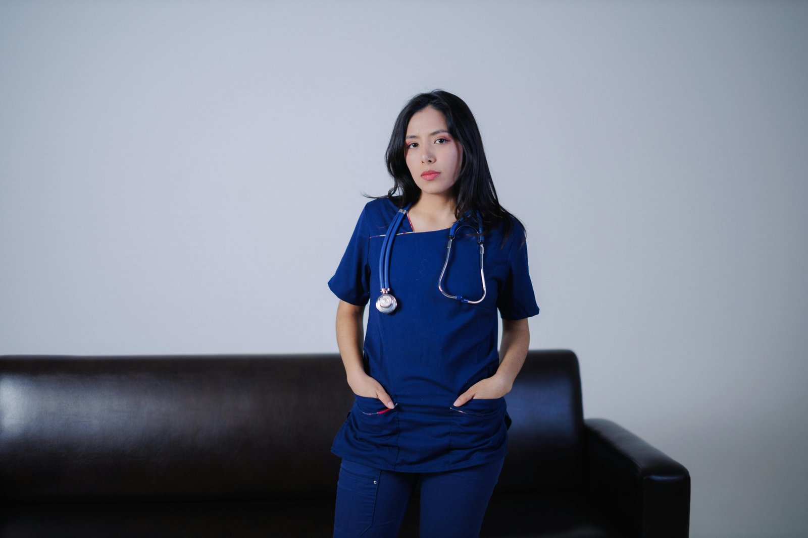 Travel certified nursing assistant in scrubs at healthcare facility ready for new assignments