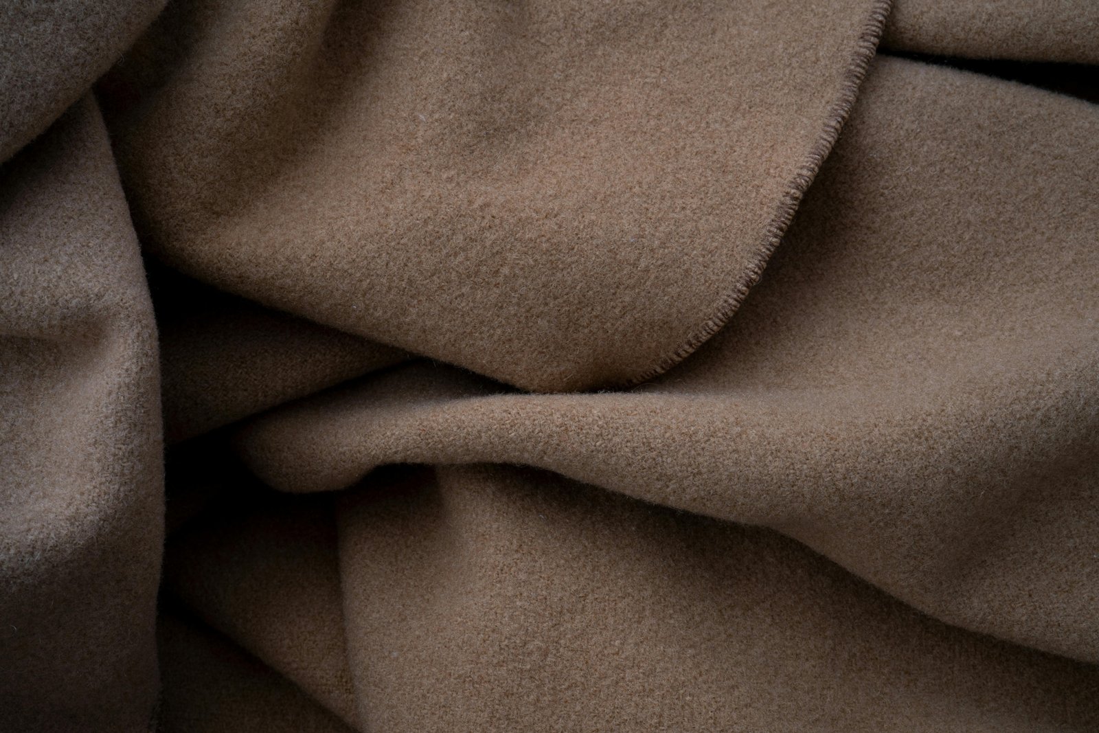 Elegant cashmere travel set with scarf, blanket, and eye mask for cozy and comfortable travel experience