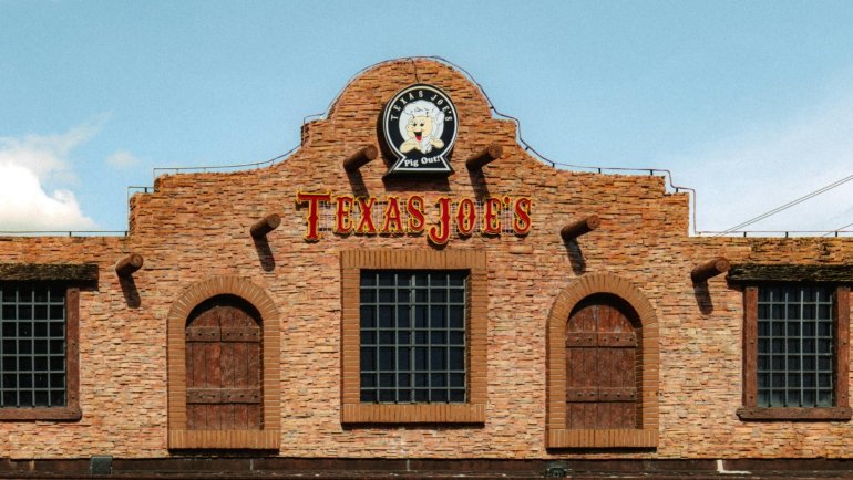 Texas BBQ smokehouse with smoked brisket, ribs, and friendly service in a cozy travel center setting