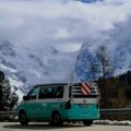 Modern Unity travel van parked in nature, perfect for road trips and van life adventures with comfortable and functional design
