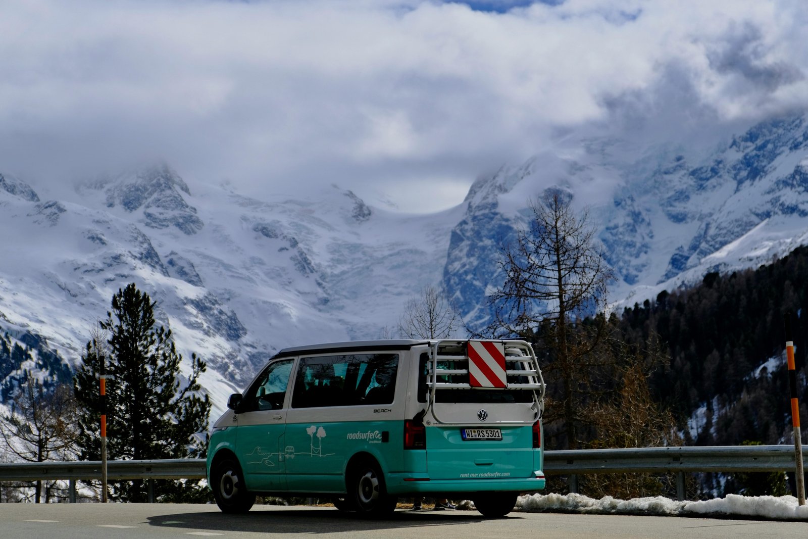 Modern Unity travel van parked in nature, perfect for road trips and van life adventures with comfortable and functional design
