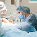 Traveling surgical technician preparing surgical instruments in hospital operating room