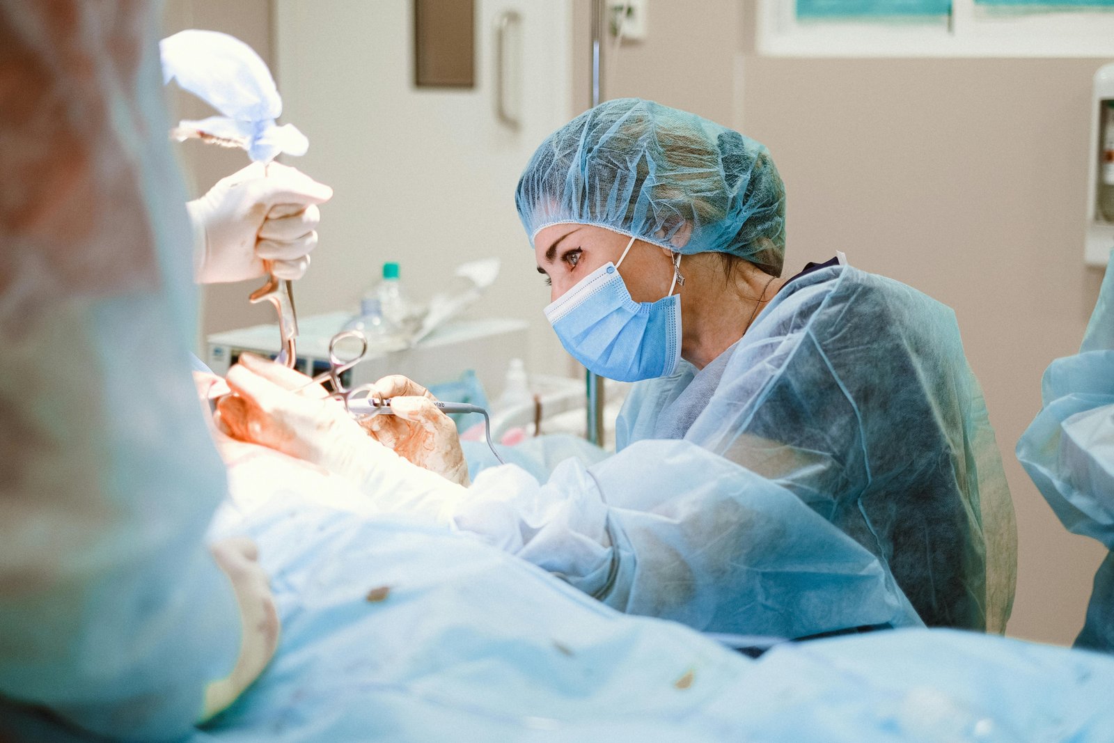 Traveling surgical technician preparing surgical instruments in hospital operating room