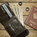 Minimalist travel wallet with passport, credit cards, and boarding pass showcasing durability and RFID protection for secure travel