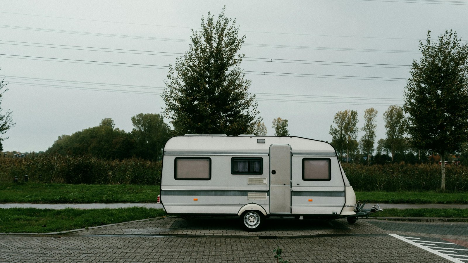 Two bedroom travel trailer parked in a scenic campsite providing privacy and comfort for family camping adventures