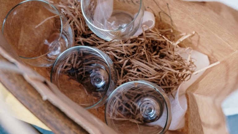 Durable wine glass travel case with padded compartments protecting fragile wine glasses during travel