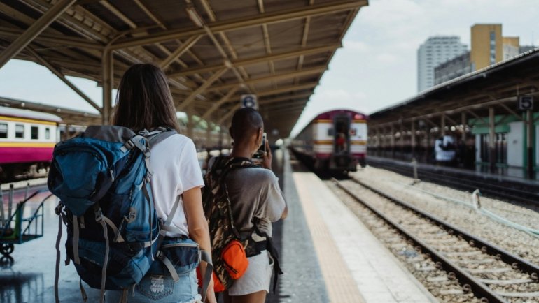 Traveler with a durable 50 liter travel backpack ready for adventure