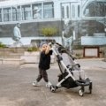 Lightweight compact travel stroller used by parents for easy transport during travel and outdoor adventures