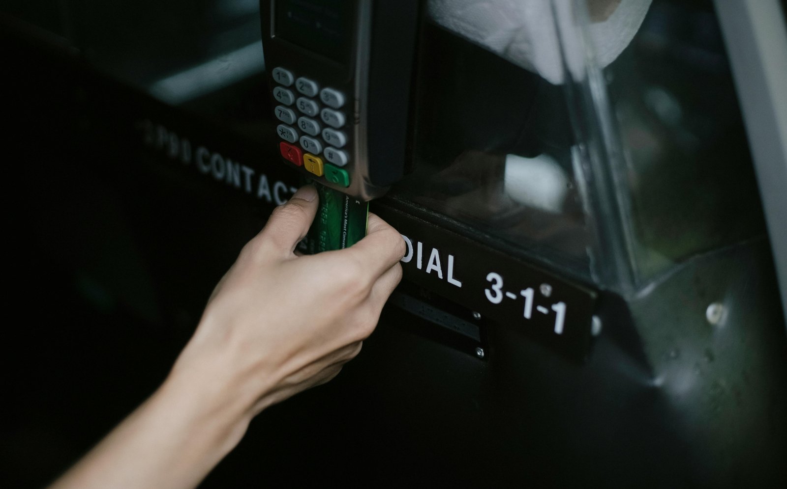 Traveler using debit card for secure payment abroad with no foreign transaction fees