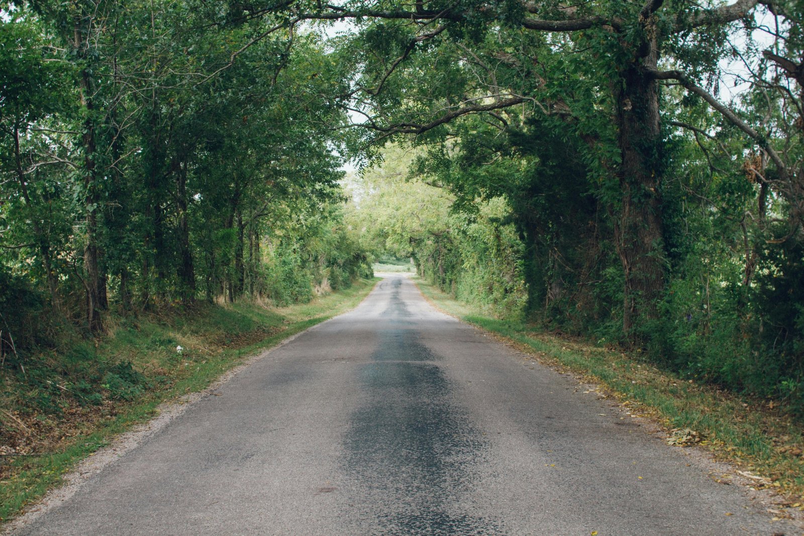 Traveler walking peacefully on a nature path symbolizing spiritual protection and faith during safe travel