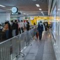 Travel security guard monitoring airport terminal ensuring passenger safety and security