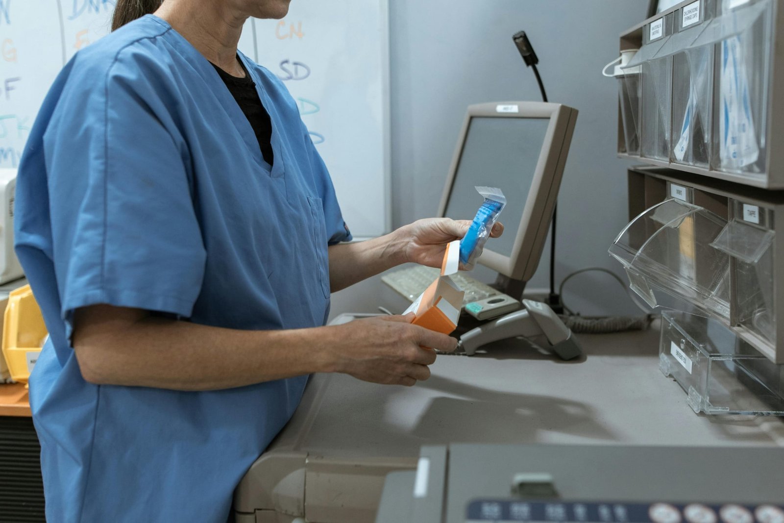 Pharmacy technician at work in a hospital pharmacy preparing medication, representing travel pharmacy technician jobs and flexible healthcare careers