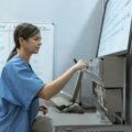 Travel nurse in scrubs enjoying sunny beach environment in Florida combining healthcare and lifestyle benefits
