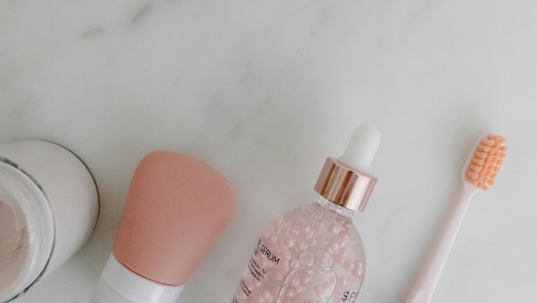 Compact travel skincare products including bottles and creams arranged with travel accessories for easy and convenient skincare on the go