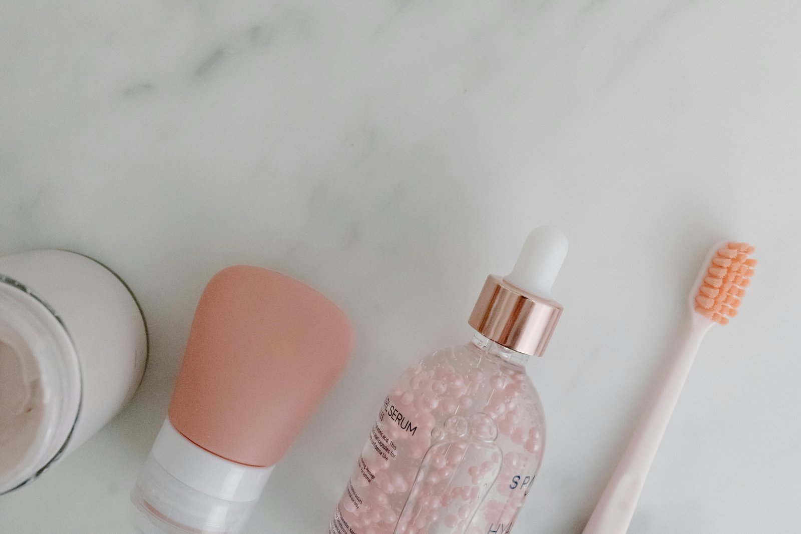 Compact travel skincare products including bottles and creams arranged with travel accessories for easy and convenient skincare on the go