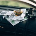 Organized car interior with travel accessories including phone mount, seat cushion, and car organizer for a comfortable and safe road trip