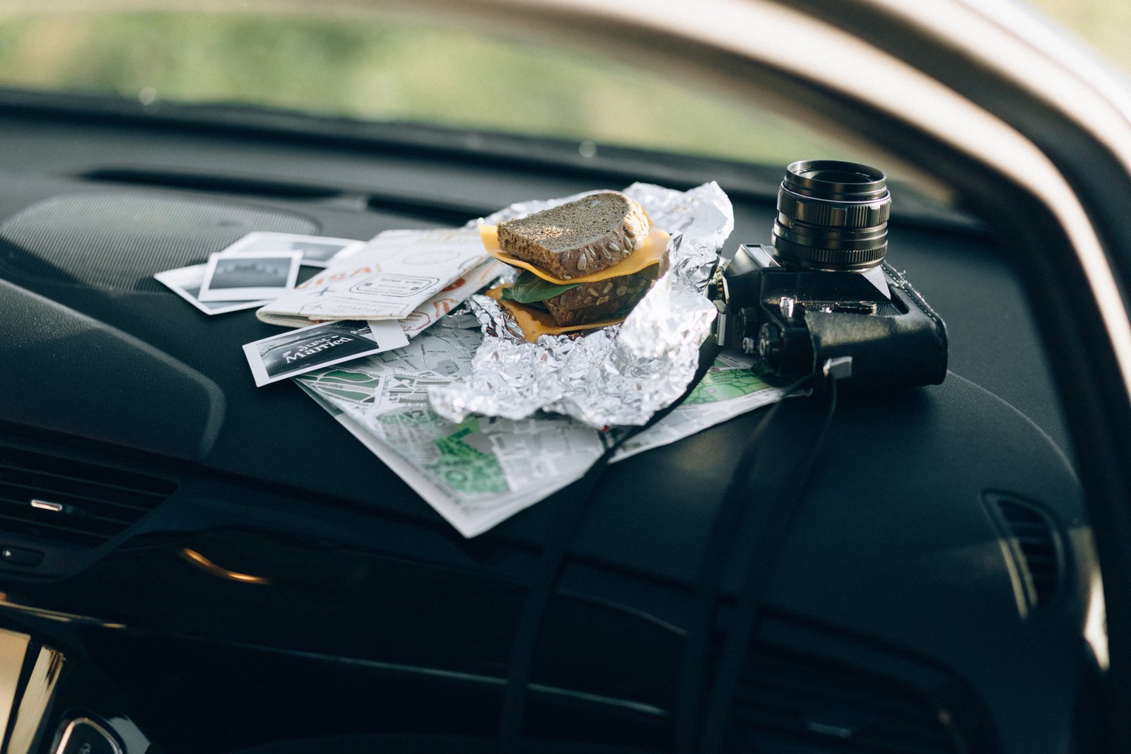 Organized car interior with travel accessories including phone mount, seat cushion, and car organizer for a comfortable and safe road trip