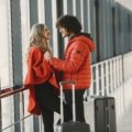 Travelers with luggage at Denver International Airport preparing for a hassle-free vacation with travel packages