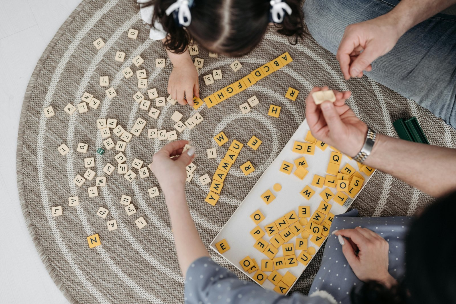 Family playing travel games together in a car during a road trip, enjoying fun and bonding