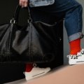 Travel bag with separate shoe compartment neatly packing shoes and clothes for organized travel