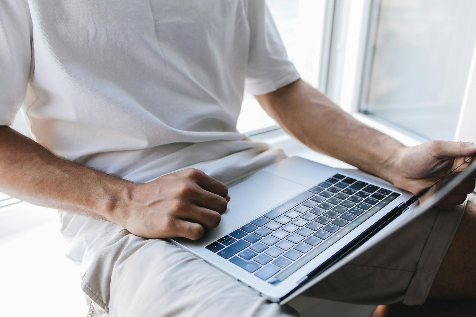 User logging into travel insurance consultants online portal on laptop for secure account management