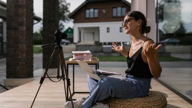 Travel influencer creating content at an exotic location representing ambassador travel benefits and experiences