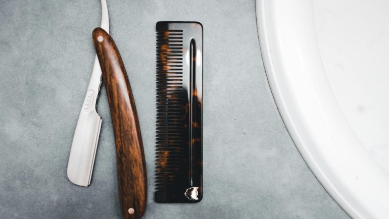 Compact travel razor and grooming kit neatly packed in a toiletry bag for easy and convenient shaving on the go