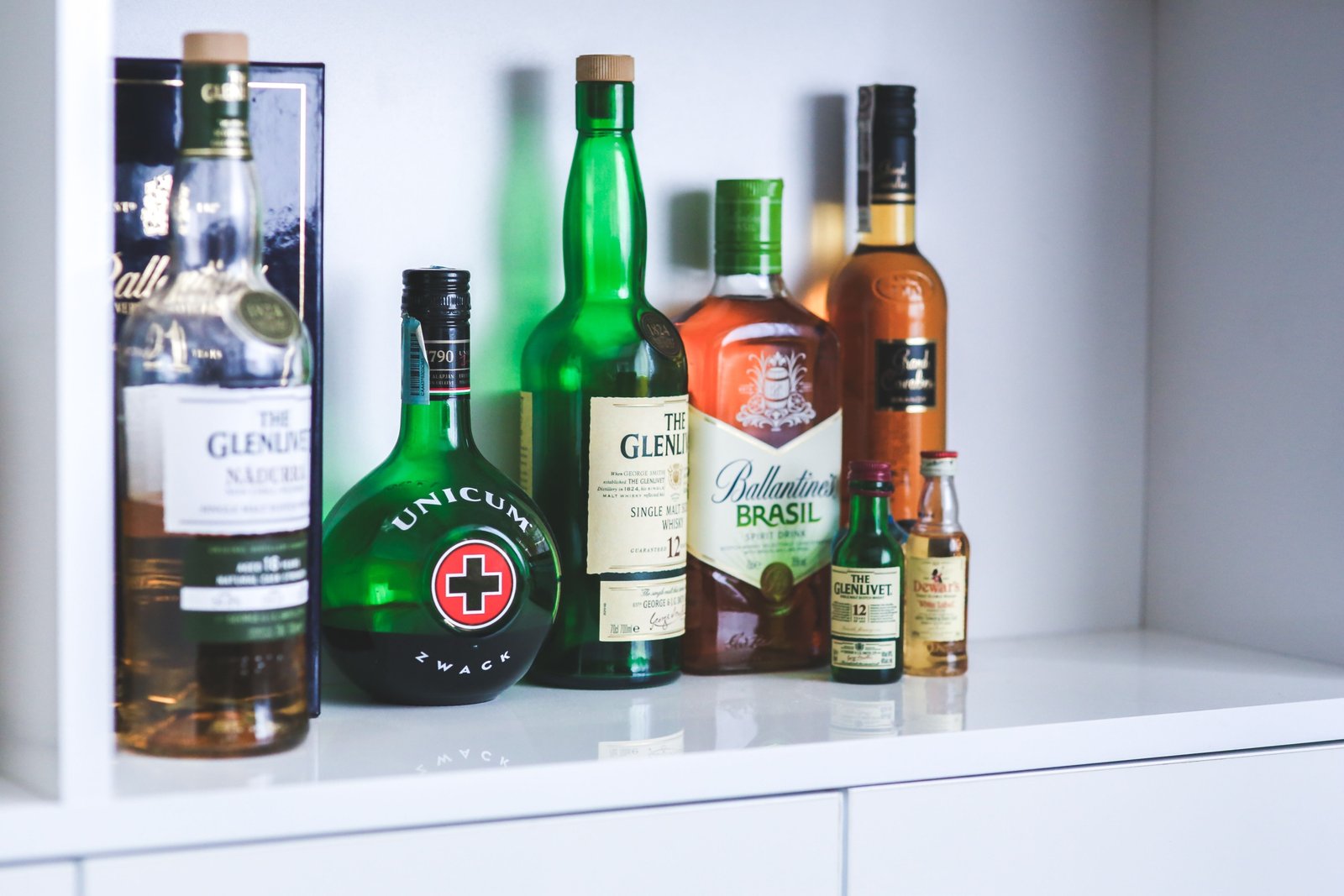 Traveler whiskey bottles displayed in an airport duty-free shop with exclusive packaging and travel retail pricing