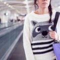 Traveler wearing comfortable and stylish travel sweatpants with secure pockets at the airport