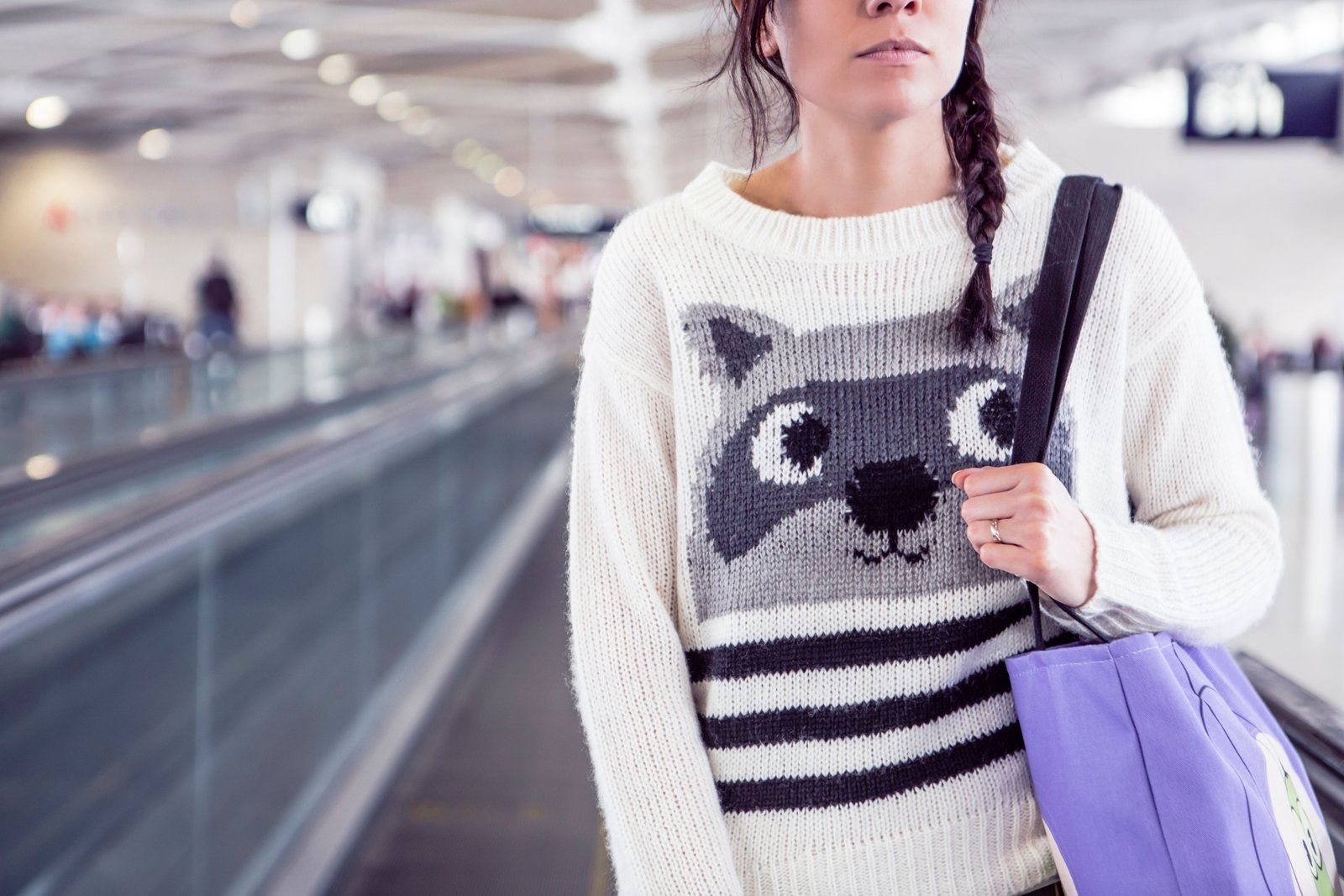 Traveler wearing comfortable and stylish travel sweatpants with secure pockets at the airport