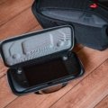 Puffco Peak Pro vaporizer in a custom compact travel case with accessories, showcasing portable dab setup for on-the-go use
