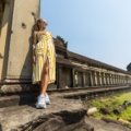 Woman wearing comfortable travel maxi dress outdoors, stylish and versatile outfit for travel adventures