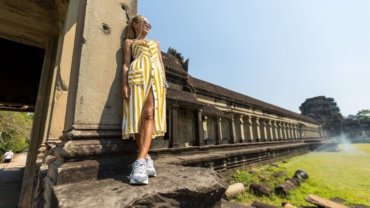 Woman wearing comfortable travel maxi dress outdoors, stylish and versatile outfit for travel adventures