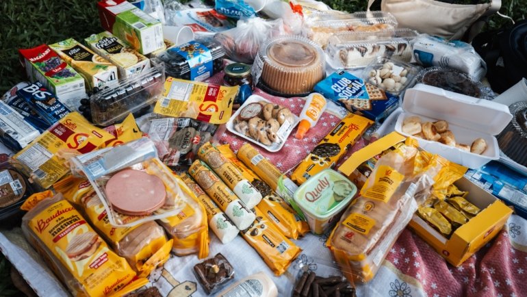 Portable travel snacks including trail mix, granola bars, nuts, and jerky ideal for hiking and outdoor trips