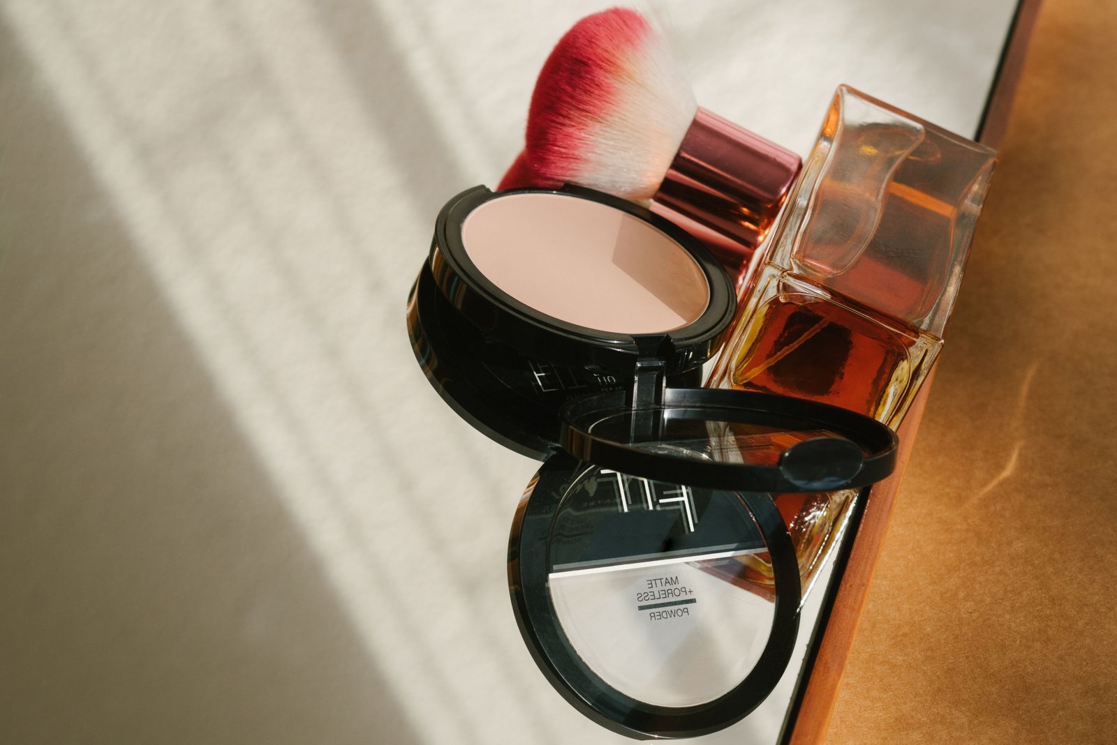 Compact travel perfume spray bottle with travel essentials for convenient and stylish fragrance on the go