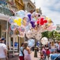 Family enjoying a fun and stress-free Orlando vacation with theme parks in the background
