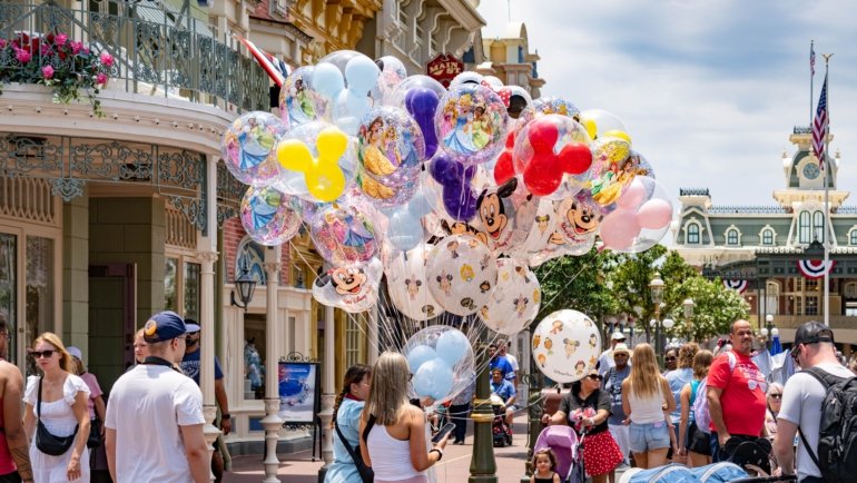 Family enjoying a fun and stress-free Orlando vacation with theme parks in the background