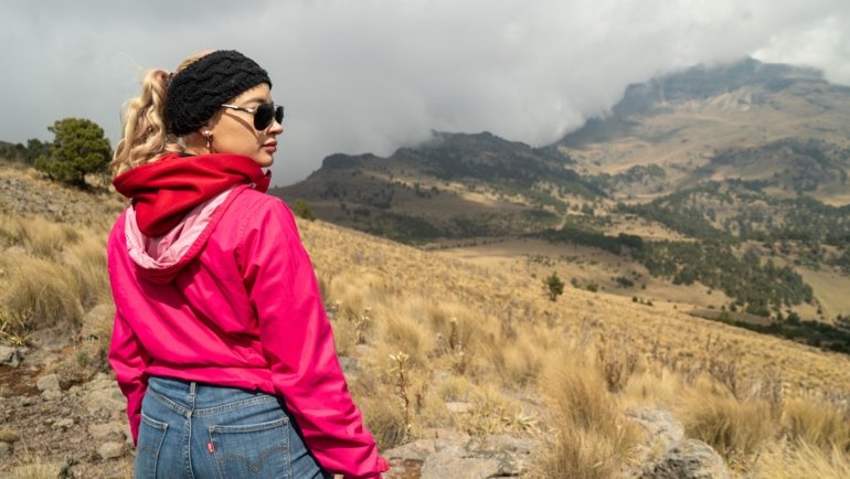 Traveler wearing a durable fake wedding band made of silicone during outdoor adventure