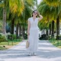 Traveler in lightweight summer outfit enjoying outdoor summer travel with comfortable clothing and sun protection