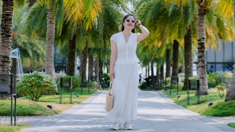 Traveler in lightweight summer outfit enjoying outdoor summer travel with comfortable clothing and sun protection