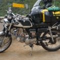 Motorcycle loaded with durable travel bags on an open road ready for a long-distance journey