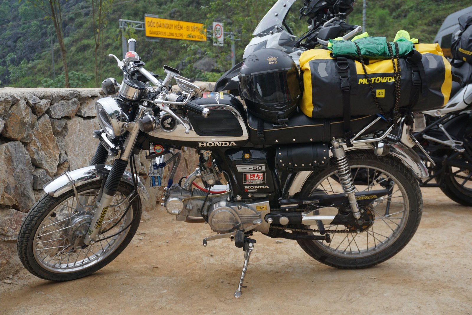 Motorcycle loaded with durable travel bags on an open road ready for a long-distance journey