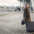 mz wallace stylish lightweight travel bag at airport with multiple compartments and durable design